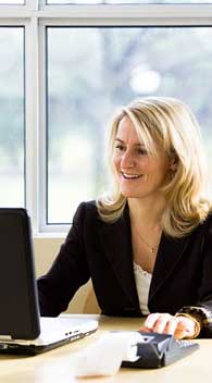 Woman Managing Rental Property from her Office Computer